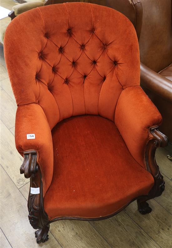 A Victorian mahogany red button backed armchair